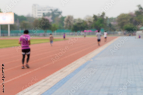 Blurred background of a man jogging on track