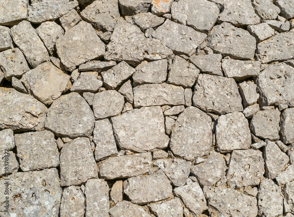 Traditional wall of stones built without lime. Dry stone wall. Traditional wall of stones built without lime. Dry stone wall.