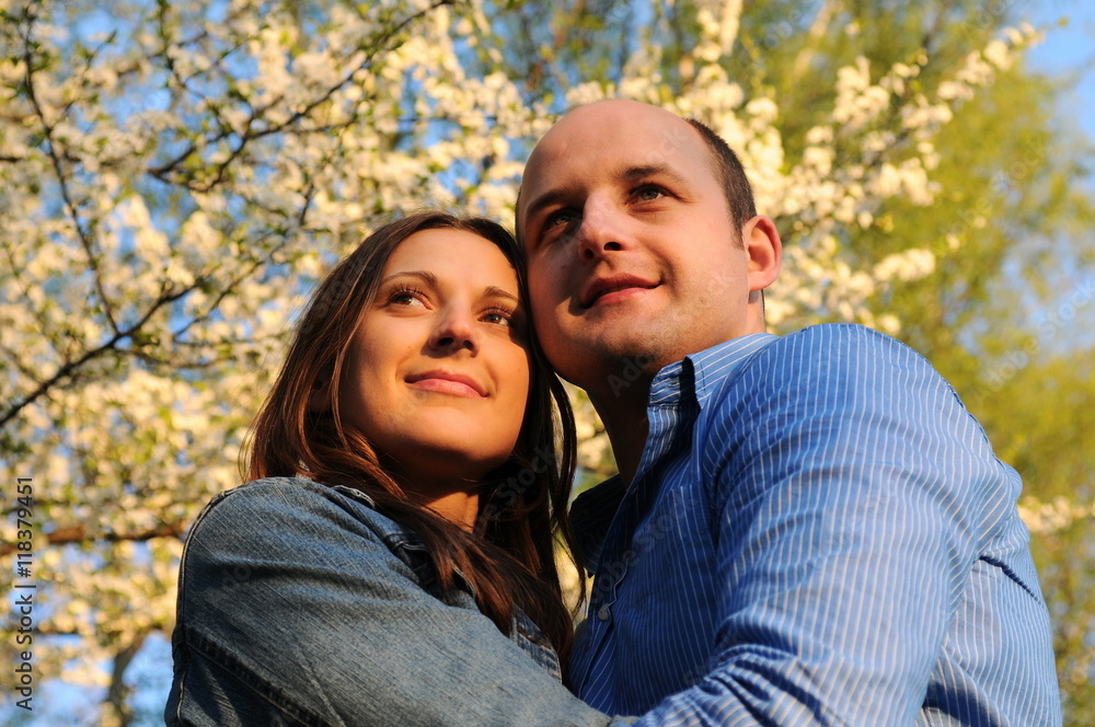 Portrait of happy couple enjoying spring in park.Dating. Love story Portrait of happy couple enjoying spring in park.Dating. Love story