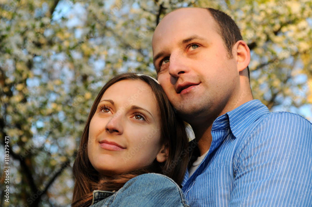 Portrait of happy couple enjoying spring in park.Dating. Love story Portrait of happy couple enjoying spring in park.Dating. Love story