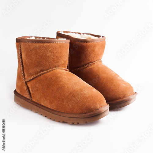 Fotografie Fluffy woolly warm boots isolated over white