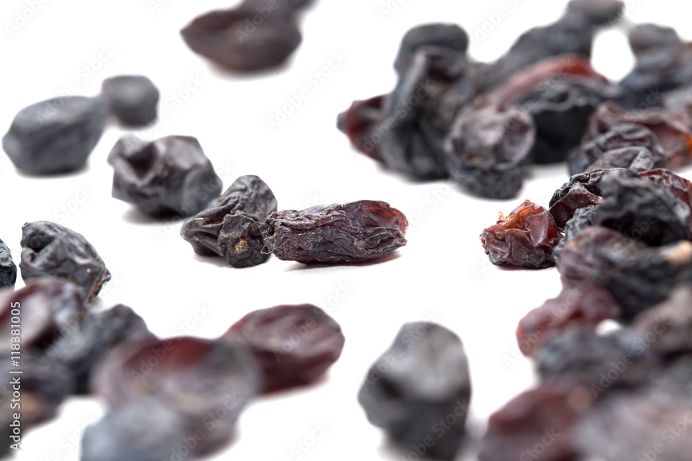 Black raisins on a white background. macro Black raisins on a white background. macro