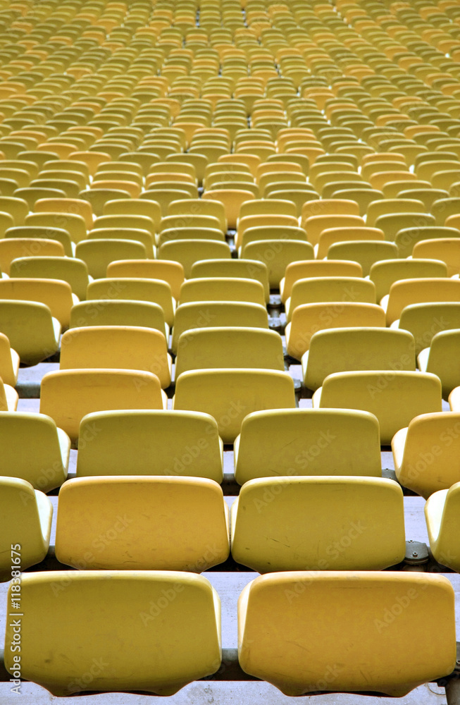 Obraz premium Green Stadium seating in rows from behind