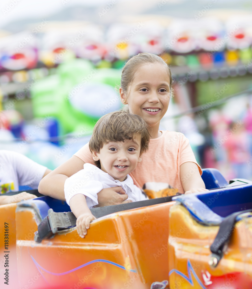 Obraz premium Happy children having fun riding