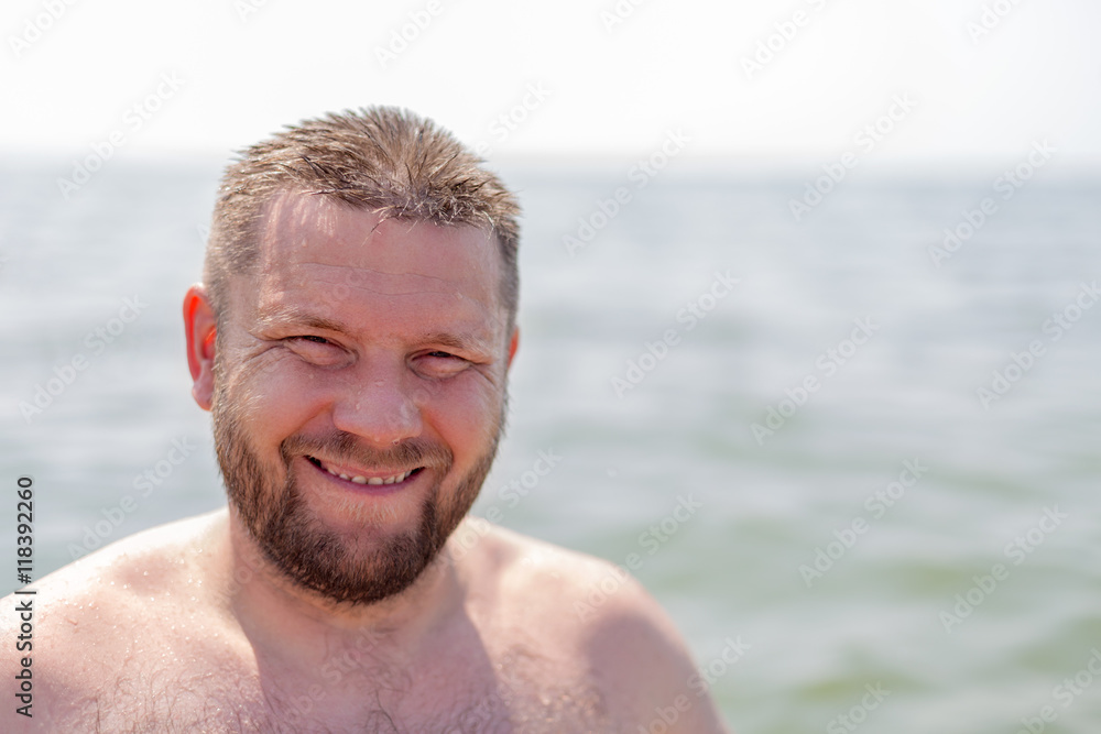 Closeup portrait of smiling bearded man