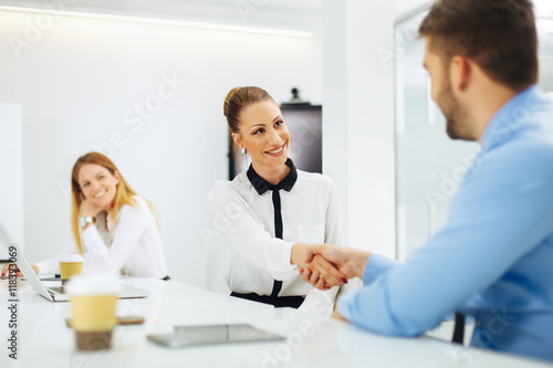 Business people shaking hands after a successful agreement