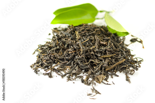 Tea with the green leaves on the white background - isolated