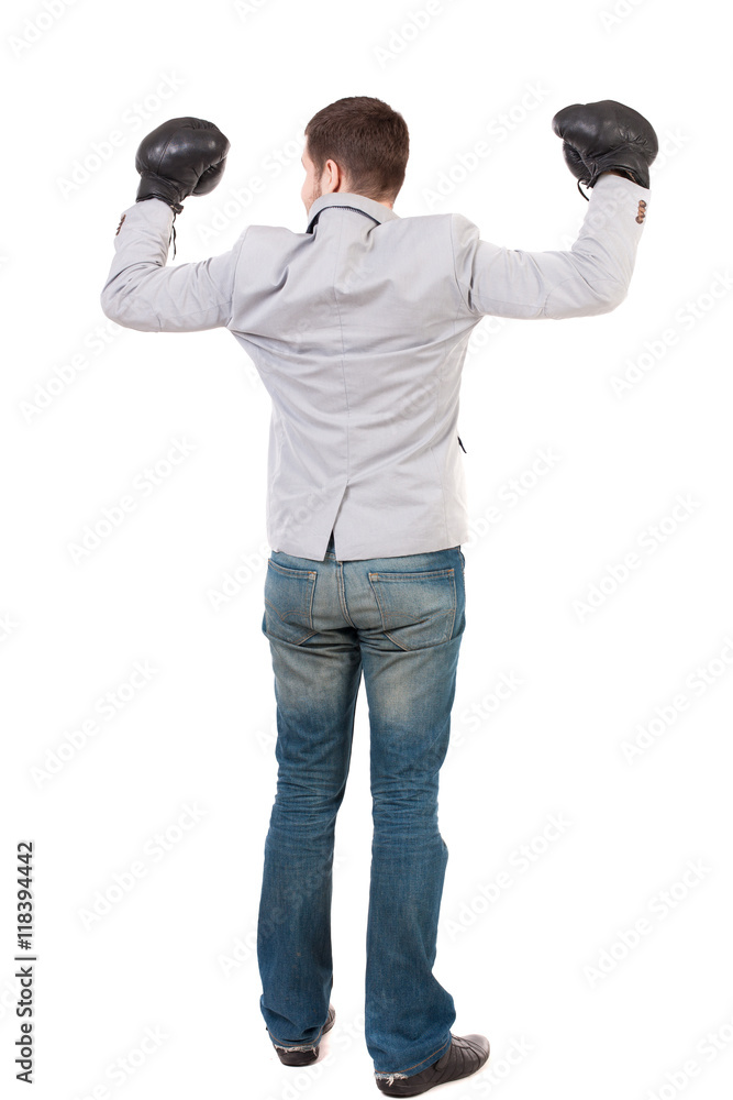 businessman with boxing gloves in fighting stance. Isolated over white background. Rear view people collection. backside view of person. Man in gray suit and boxing gloves celebrating the victory. businessman with boxing gloves in fighting stance. Isolated over white background. Rear view people collection. backside view of person. Man in gray suit and boxing gloves celebrating the victory.