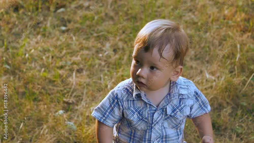 close up portrait of baby boy outdoor in slow motion close up portrait of baby boy outdoor in slow motion