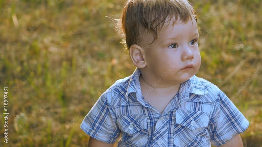 close up portrait of baby boy outdoor in slow motion close up portrait of baby boy outdoor in slow motion