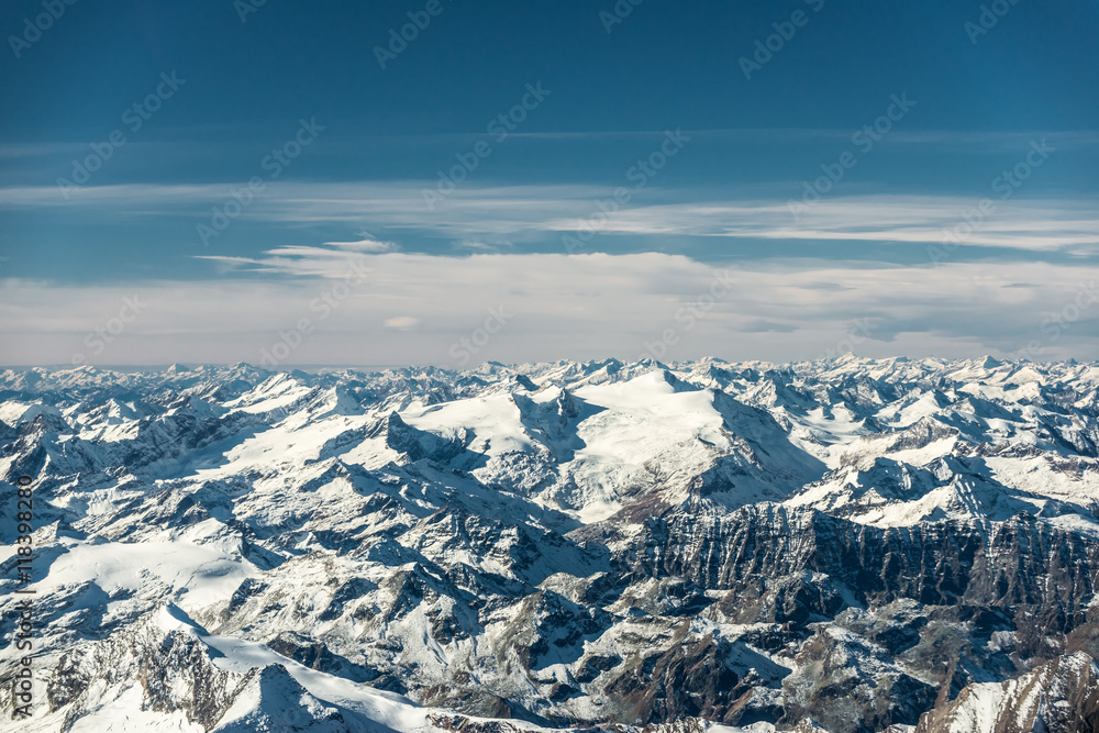 Fototapeta premium over the mountain peaks covered with snow at winter in austrian alps