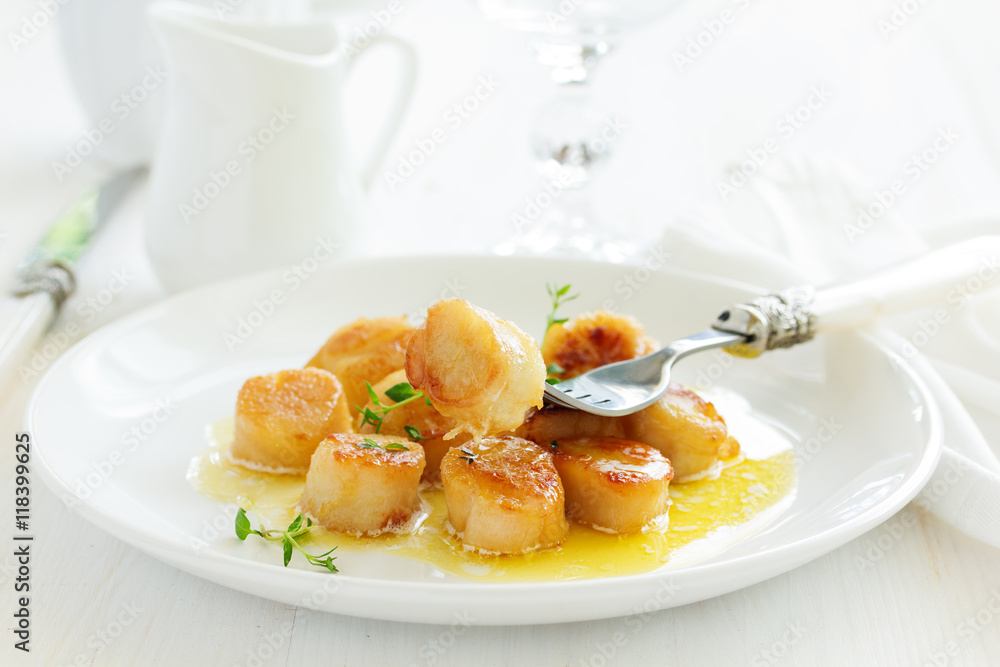Scallops fried in cream sauce with herbs. Scallops fried in cream sauce with herbs.