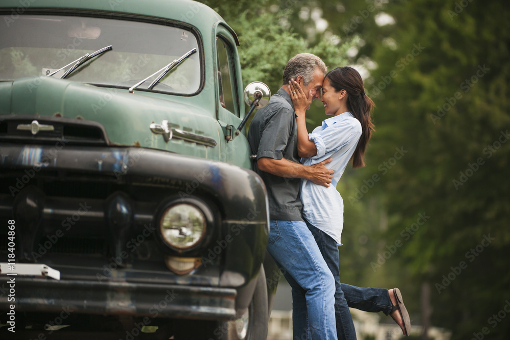 Couple kissing by truck outdoors Couple kissing by truck outdoors