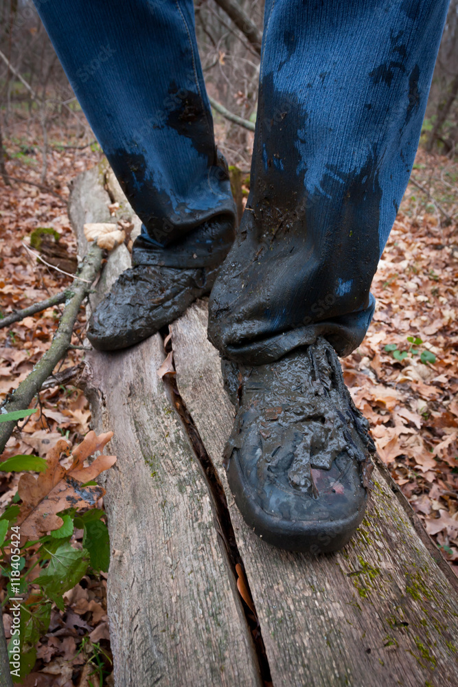 boots men in the dirt on a log in forest boots men in the dirt on a log in forest