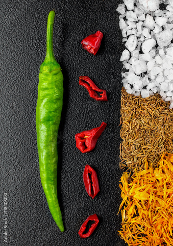 Green hot pepper chili and cuted red chili, stripe of saffron, s