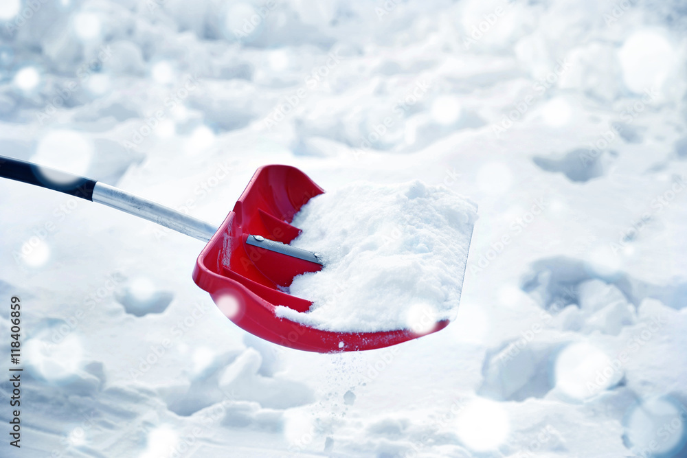 Fototapeta premium Red plastic shovel for snow. Snow effect