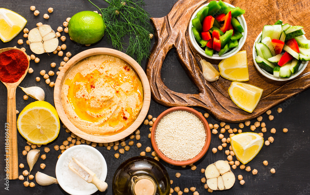Hummus on a black wooden background Hummus on a black wooden background