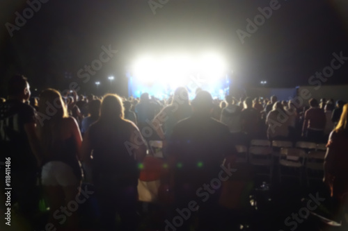 Fototapeta Naklejka Na Ścianę i Meble -  blur background of people at concert with bright lights