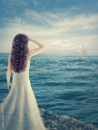 Girl waiting for a ship photo