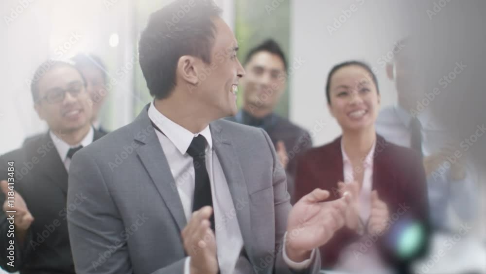 Cheerful Asian business group clapping the speaker at business conference Cheerful Asian business group clapping the speaker at business conference