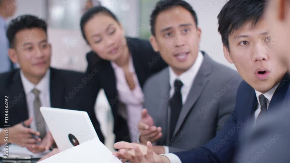 Asian corporate business group in discussion in business meeting Asian corporate business group in discussion in business meeting
