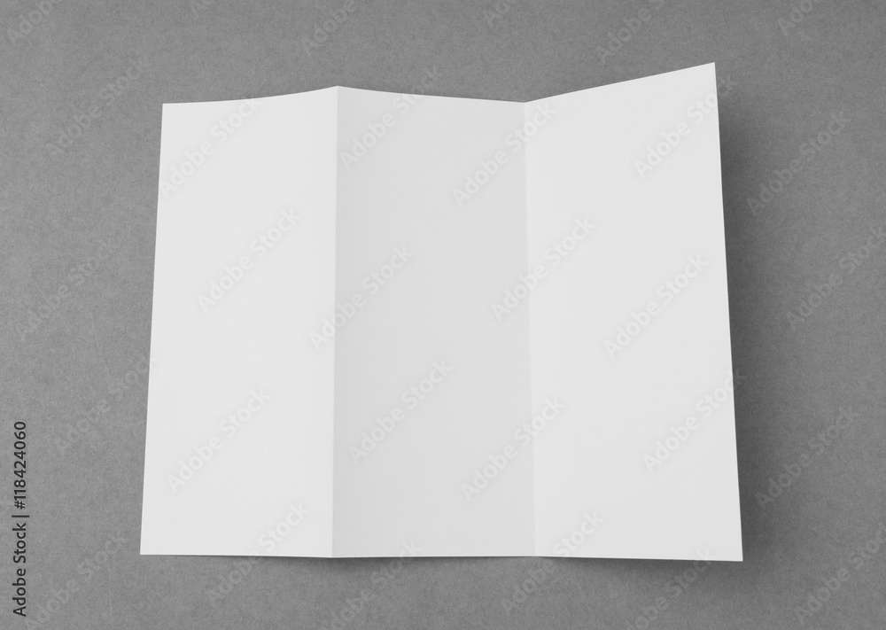 Trifold white template paper on gray background . Trifold white template paper on gray background .