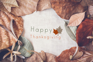 Happy thanksgiving on Autumn leaves toning background