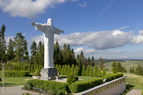Obraz na płótnie Big white Statue of Jesus over Landscape, Klin, Slovakia w salonie