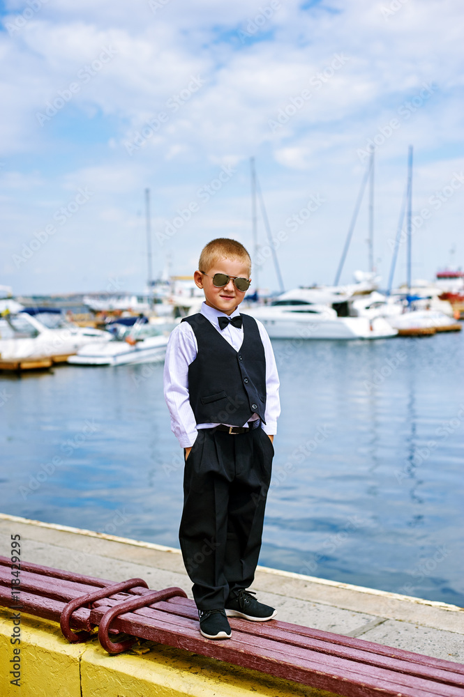 handsome boy in sunglasses at the seaport handsome boy in sunglasses at the seaport