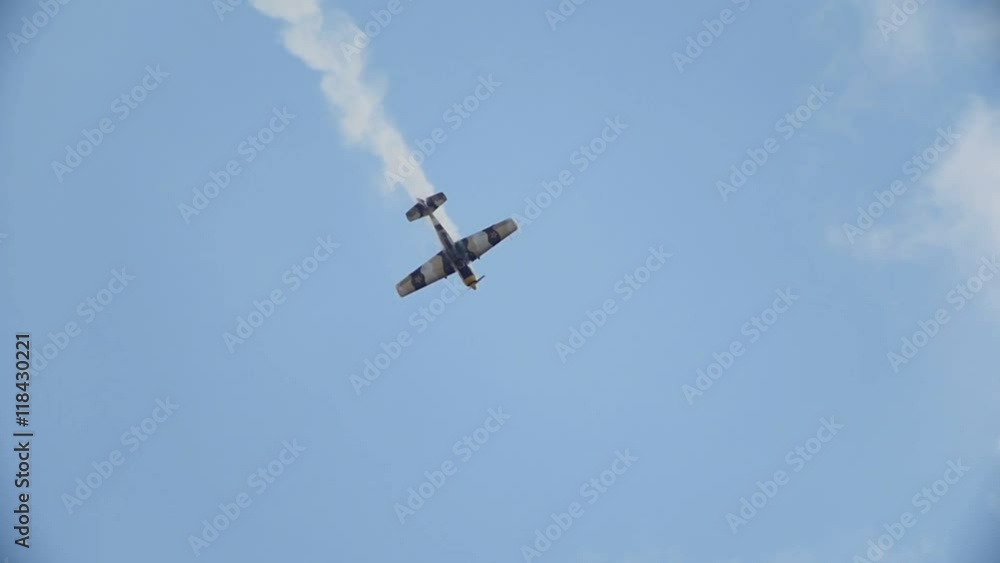 An old historical military soviet russia plane flying and performs aerobatics - crash down, slow motion