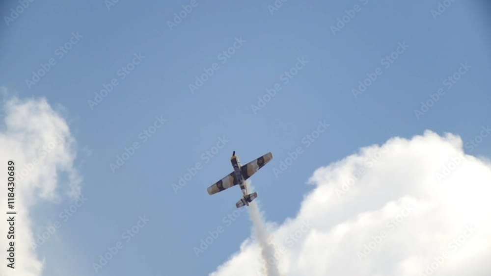 An old historical military soviet russia plane flying and performs aerobatics - vertical barrel roll, slow motion An old historical military soviet russia plane flying and performs aerobatics - vertical barrel roll, slow motion