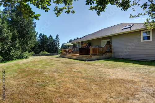 Wallpaper Mural Backyard house exterior with patio area and hot tub on the walkout deck. Torontodigital.ca