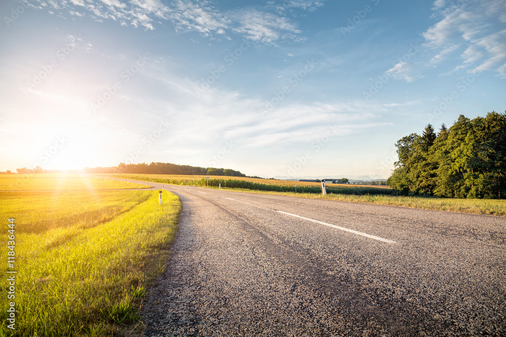 Empty country road at sunrise