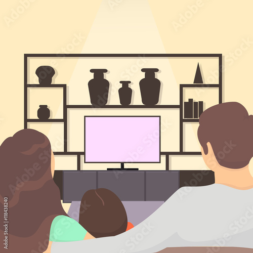 family watching tv together. family sitting on sofa watching television