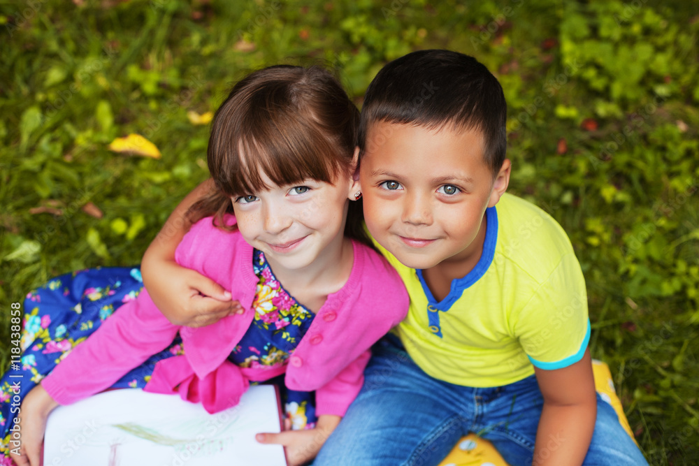little boy hugging a beautiful girl