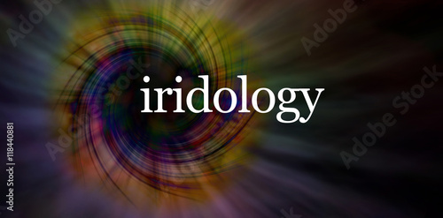 Iridology eye specialist concept banner - wide modern banner with a white IRIDOLOGY sitting on top of a dark linear spiral formation background with copy space all around photo