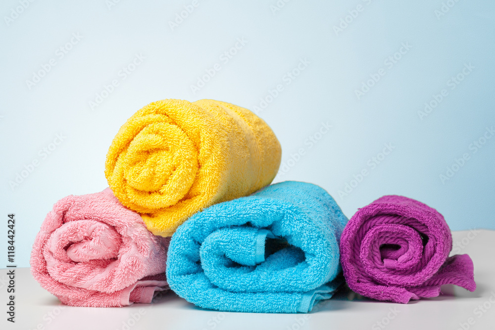 Stack of bath towels on white desk closeup Stack of bath towels on white desk closeup