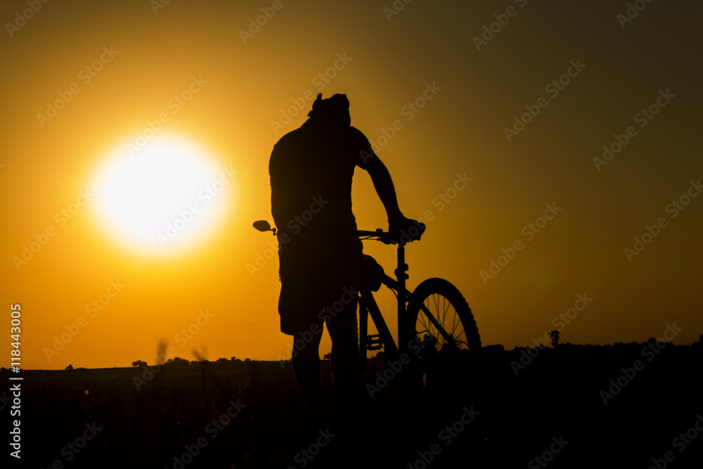 Obraz premium sunset and silhouette backlight bikers