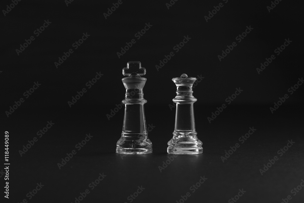 chess piece on black background with dramatic low light effect. chess piece on black background with dramatic low light effect.