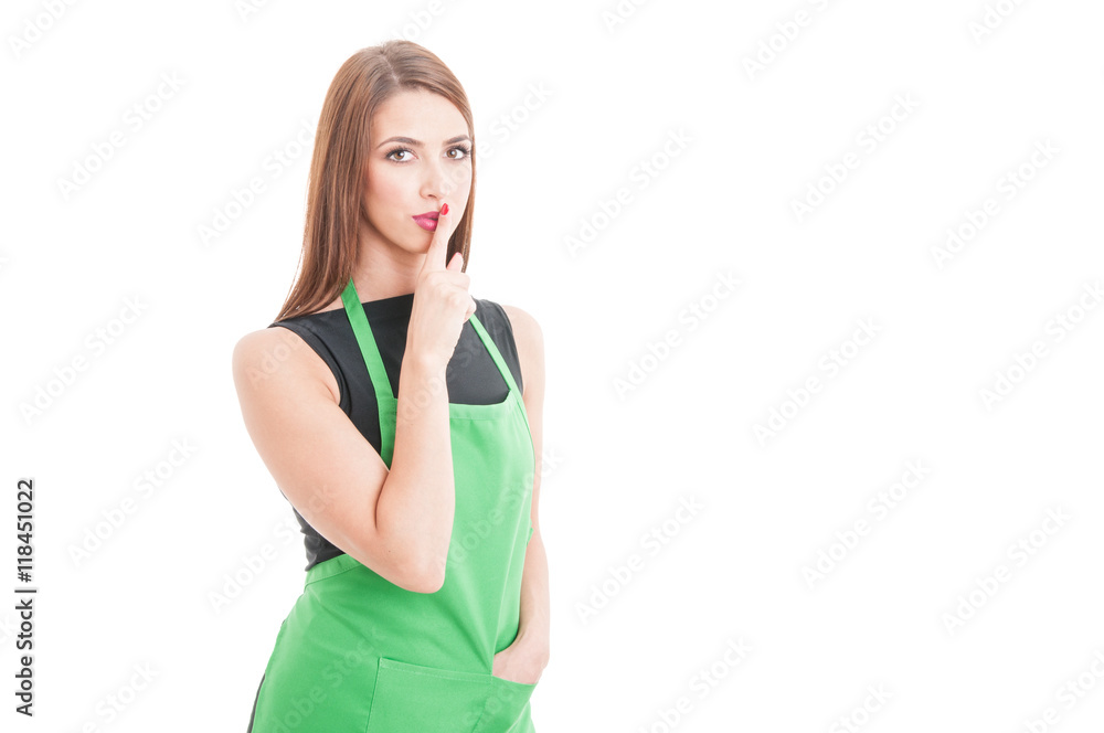 Young female employee doing a quiet gesture Young female employee doing a quiet gesture