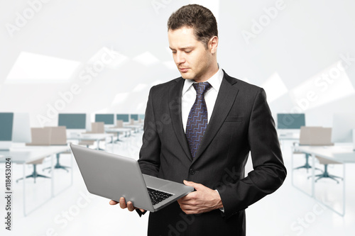 Businessman using laptop photo