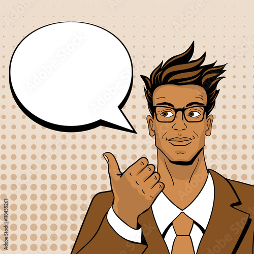 Pop art man. Young hansome man in glasses looking and pointing at speech bubble. Vector illustration in retro comic style. Vector pop art background.