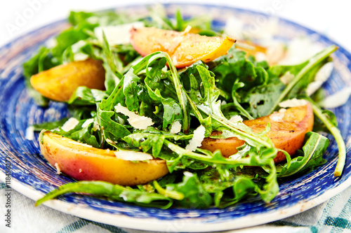 Vegetarian gourmet salad with arugula and peaches