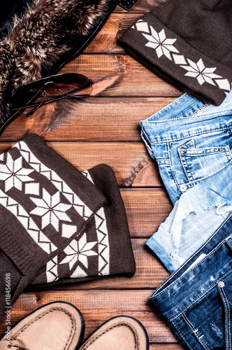 jeans and accessories on wooden boards