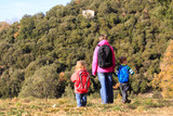 mother with two kids travel in mountains