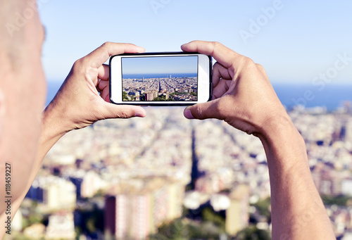 man taking a picture of Barcelona, Spain, from above