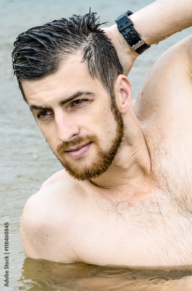 Portrait of an handsome man posing in lake Portrait of an handsome man posing in lake