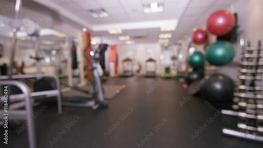 Interior view of modern gym with machines & equipment. No people Interior view of modern gym with machines & equipment. No people