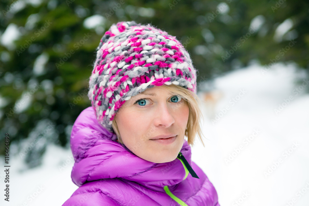 Woman hiking in white winter forest woods with akita dog. Recreation fitness and healthy lifestyle outdoors in nature. Motivation and inspirational winter landscape. Woman hiking in white winter forest woods with akita dog. Recreation fitness and healthy lifestyle outdoors in nature. Motivation and inspirational winter landscape.