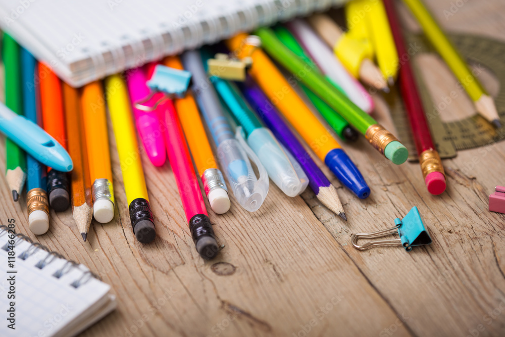 Obraz premium Pencils and pens student with a notebook